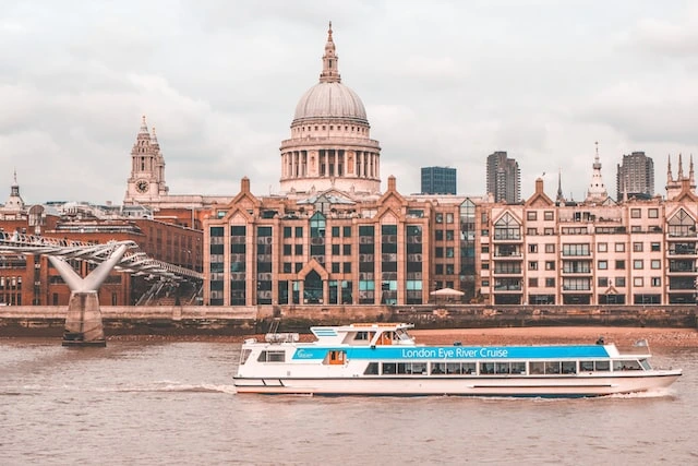 Weather in London in June: The Best Time to Visit the City 2 River Cruise flowing through the Thames River
